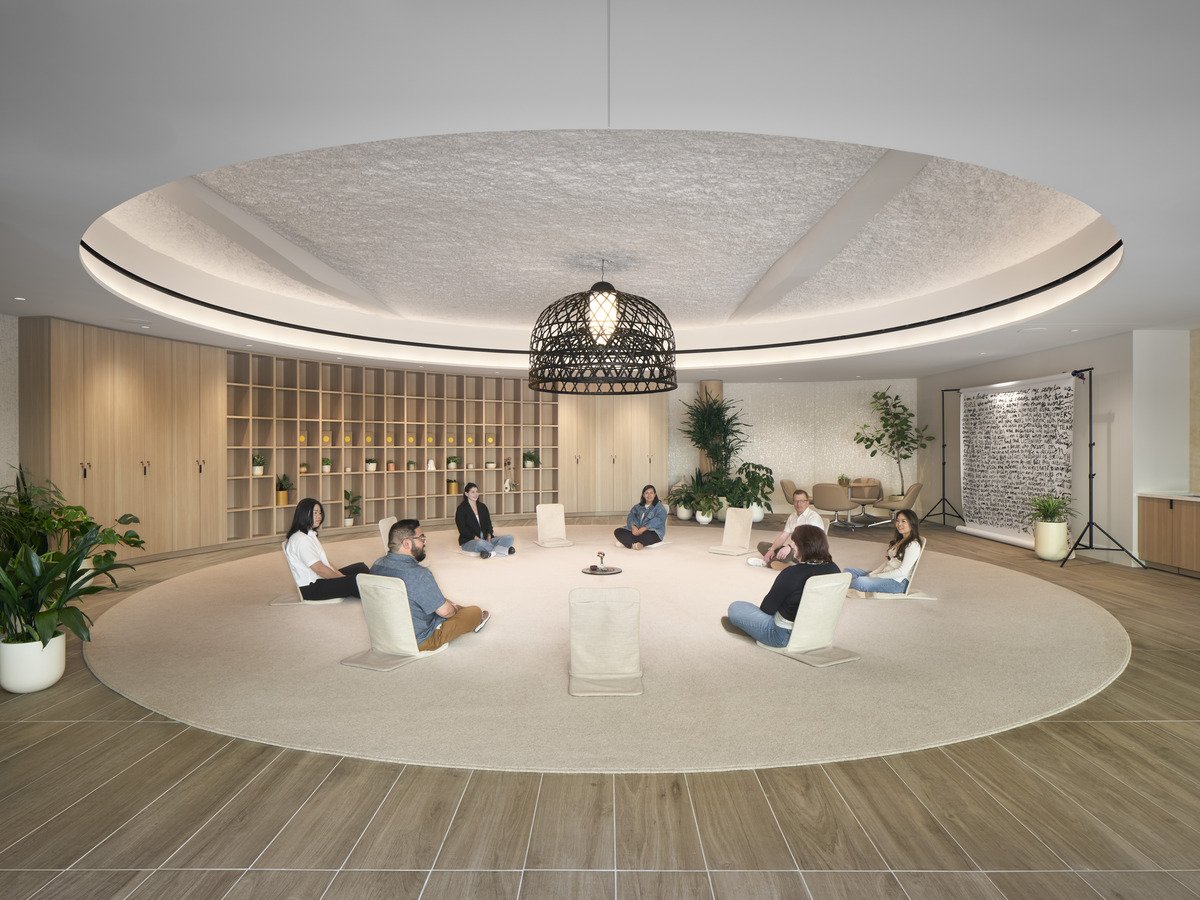Biophilic elements and warm indirect lighting within the Council and reflection space