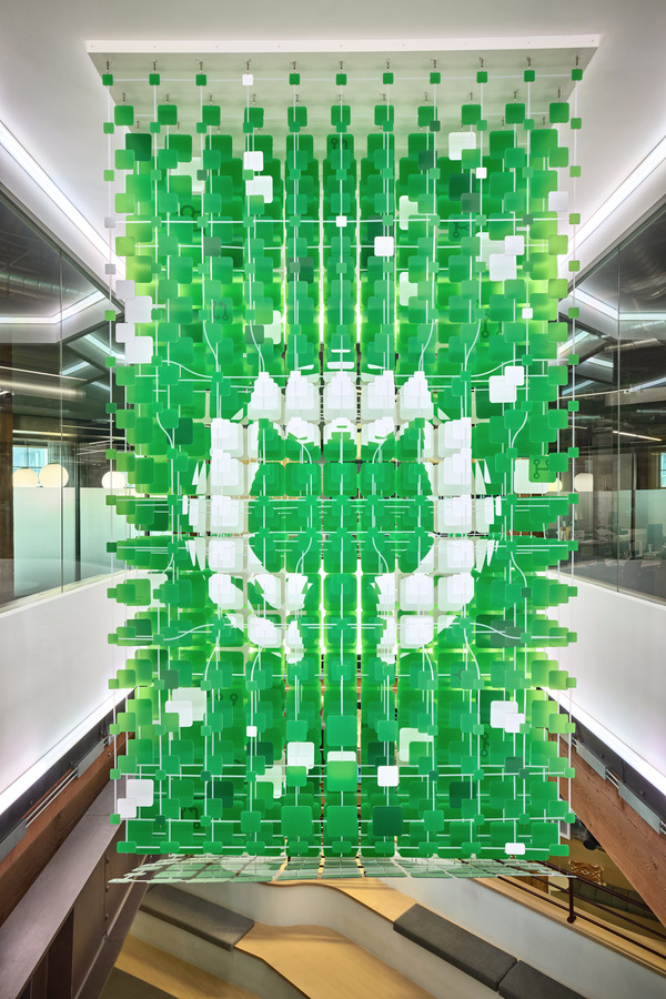 Sculpture viewed across the atrium, revealing the composition's kinetic quality