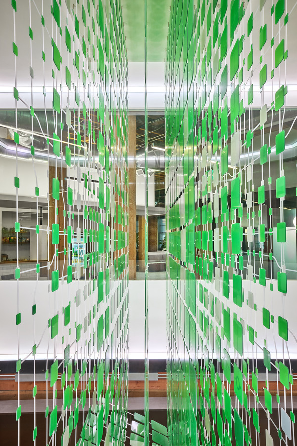 View across the atrium showing the installation's translucent, illuminated quality
