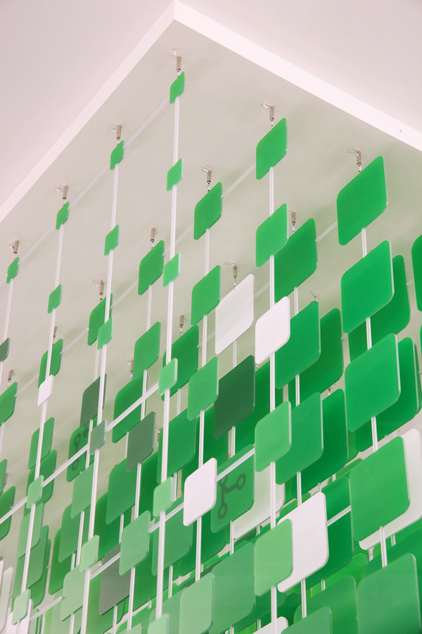 Close-up detail of octicons and community-contributed phrases embedded in the sculpture